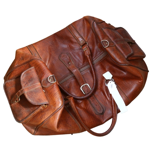 825 - A Vintage leather holdall, L60cm