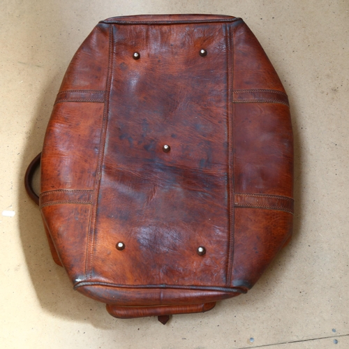 825 - A Vintage leather holdall, L60cm