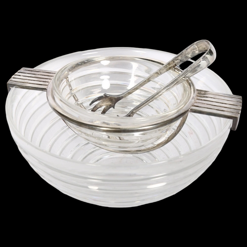 833 - Riedel Glass, a mid-century ribbed glass caviar bowl, with silver plated mounts and tongs, diameter ... 