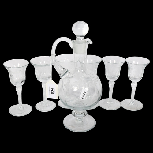 834 - An engraved glass liqueur set, decanter height 26cm