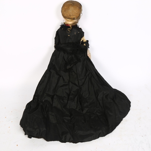 839 - An Antique wax-headed doll with painted wooden limbs, and a sawdust-filled cloth body, A/F, L48cm