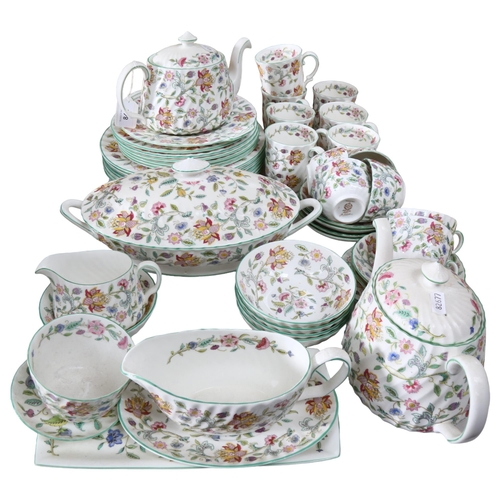 842 - Minton's Haddon Hall pattern dinner and teaware, including teapots, vegetable tureen, jugs, and a se... 