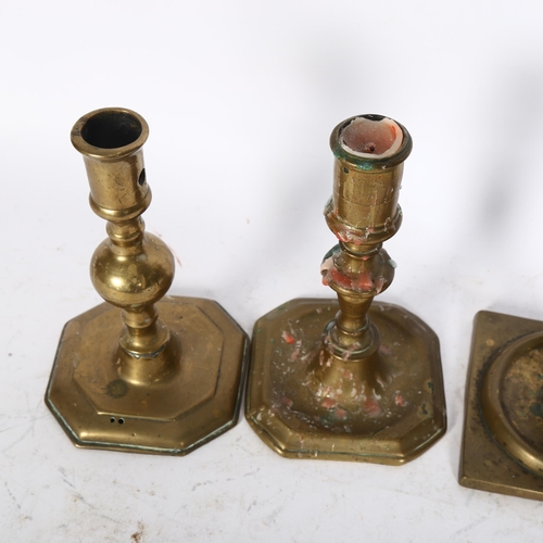 843 - A 17th/18th century Spanish bronze candlestick, together with 2 others, tallest 17cm