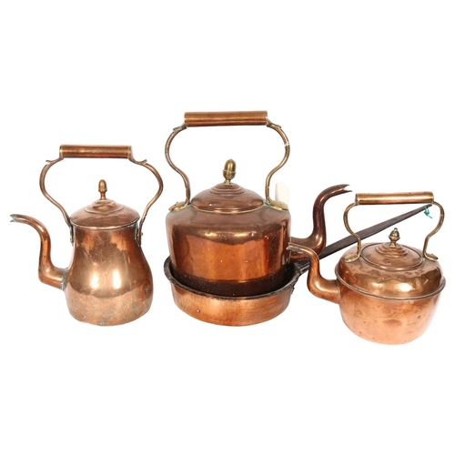 855 - A Victorian copper kettle with acorn knop, 32cm, 2 smaller kettles, and a pan with iron handle