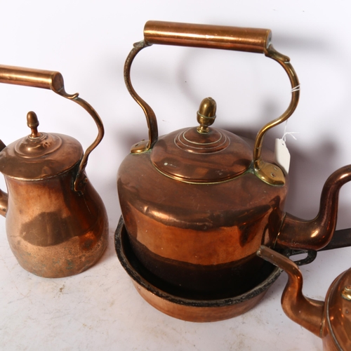 855 - A Victorian copper kettle with acorn knop, 32cm, 2 smaller kettles, and a pan with iron handle