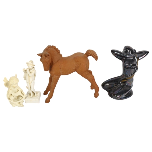 885 - A terracotta foal, H20cm, an angel, a musician, a glass bird, and an Art Deco style lustre figure