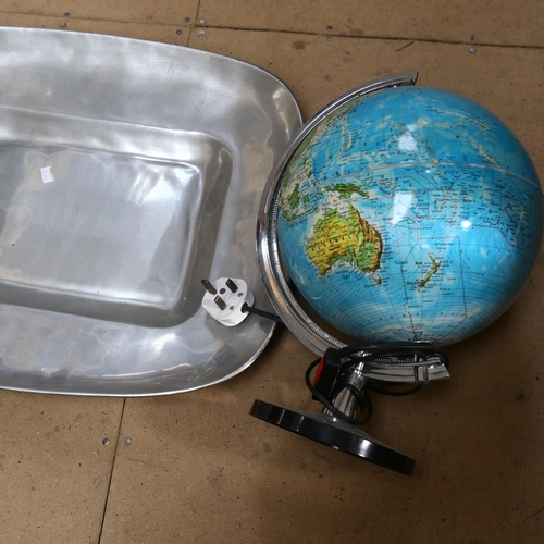 887 - A Mexican aluminium serving dish, 52cm, an illuminated globe, and a Vintage alarm clock table light