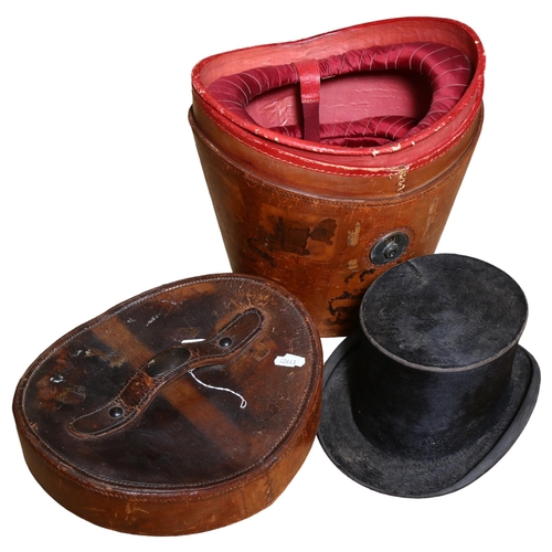 892 - An Antique lined leather hat box with a top hat, by Dunn & Co