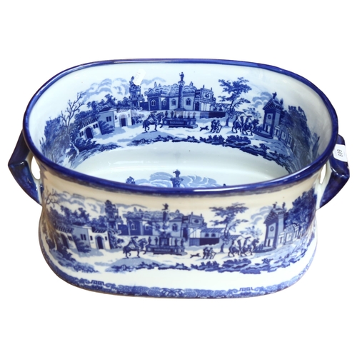 899 - A reproduction blue and white printed 2-handled foot-bath, L47cm overall