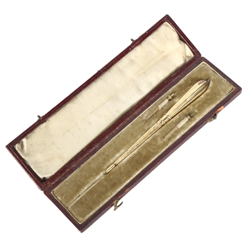 422 - An early 20th century gold plated sewing/needlework implement, with 2 screw-on barbs, in original le... 