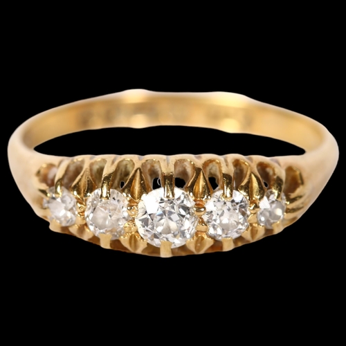 1216 - An 18ct gold five stone set diamond ring, size O