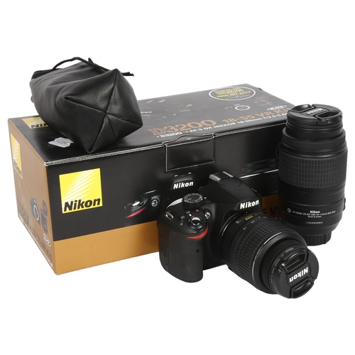 609 - NIKON - a D3200 camera and associated accessories, in original box, including a Nikon A5-SDX Nikkor ... 