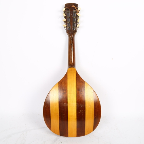 616 - An antique flat beech wood 8-string mandolin. L-60cm.