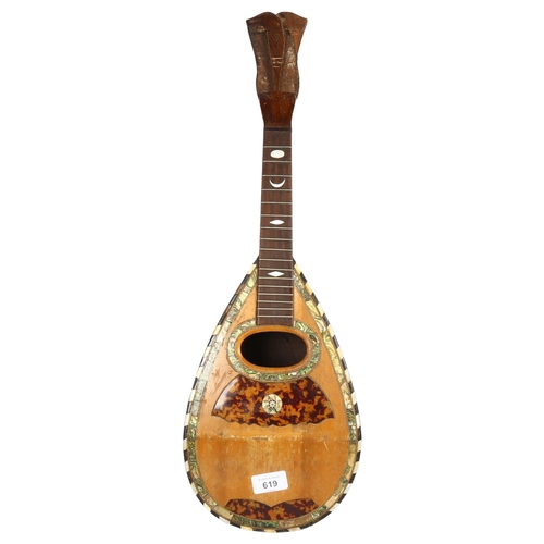 619 - A 19th century rosewood mandolin with ebony and mother of pearl banding and decoration, label to int... 