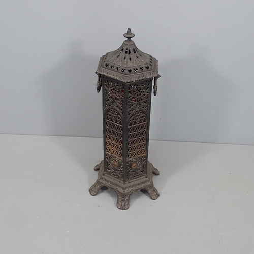 2282 - An antique octagonal cast iron station heater. Lacking fittings. Height 85cm.