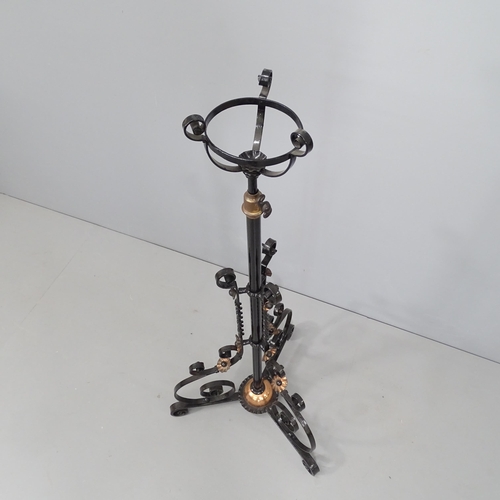 2285 - A painted wrought iron floor standing oil lamp base. Height 120cm.