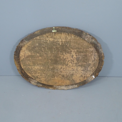 2287 - An oval wall mirror with carved and painted frame. 84x65cm.