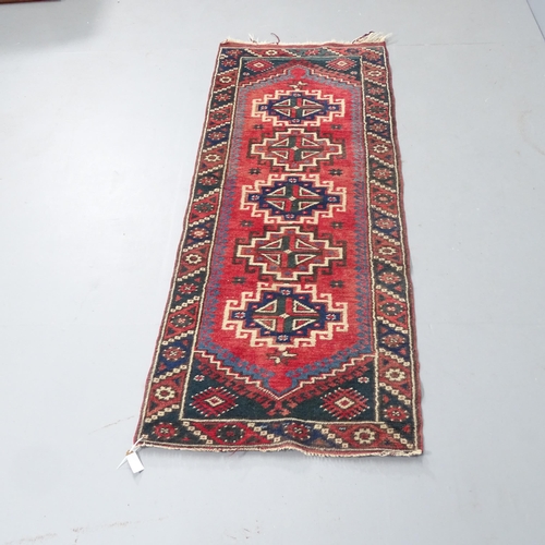 2317 - A red-ground Persian design runner. 157x60cm.