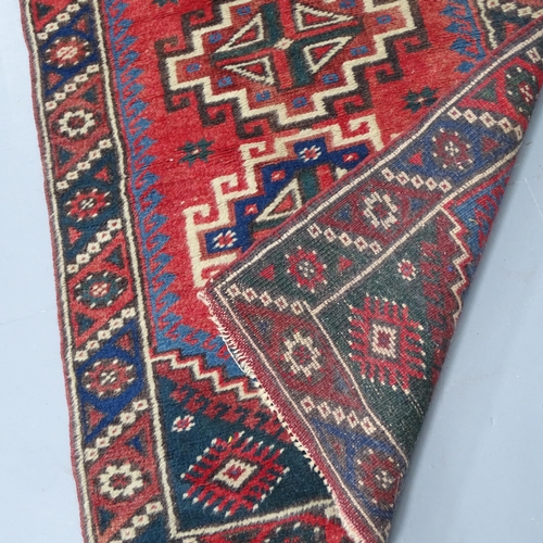 2317 - A red-ground Persian design runner. 157x60cm.