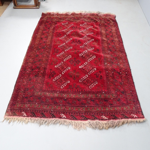 2319 - A red-ground Turkaman rug. 204x130cm.