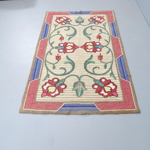 2324 - A handmade folk-art tulip design rug. 180x104cm.