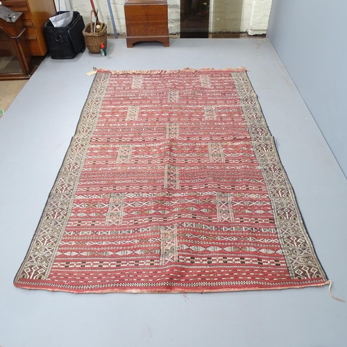 2334 - An African Tuareg carpet. 228x145cm.