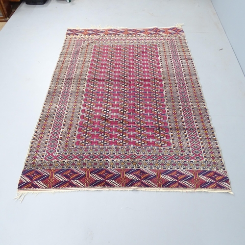 2336 - A Turkmenistan carpet. 193x126cm.