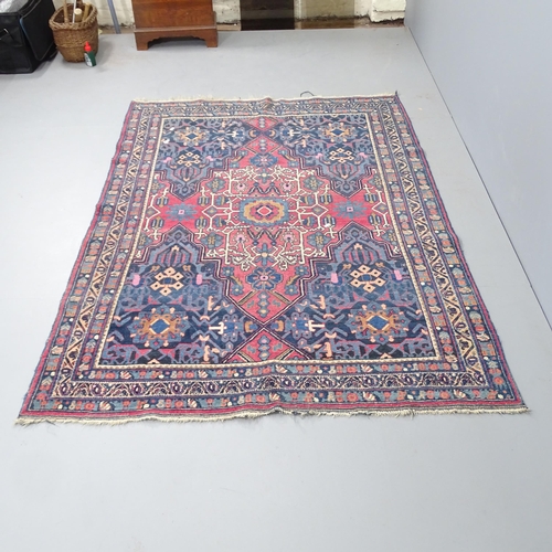 2344 - An antique red and blue-ground Persian prayer rug. 195x137cm.