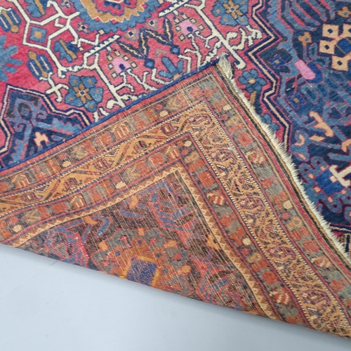 2344 - An antique red and blue-ground Persian prayer rug. 195x137cm.