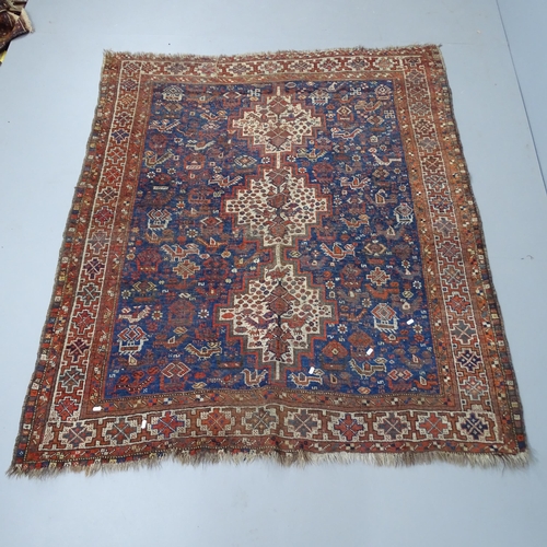 2346 - An antique blue-ground Persian rug. 185x160cm