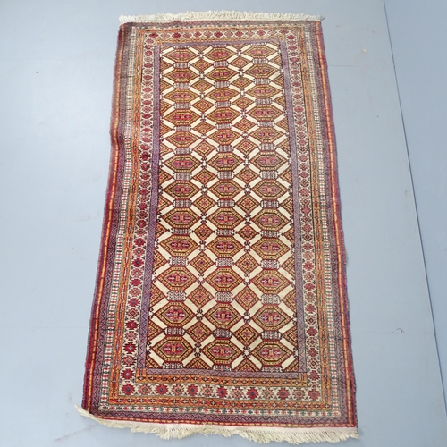 2347 - A hand made red-ground Bokhara rug. 183x99cm.