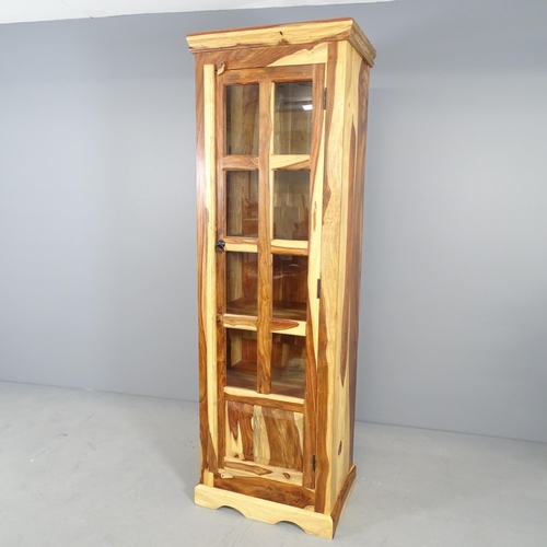 2687 - A modern sheesham kitchen cabinet, with single glazed door and shelved interior. 57x175x40cm.