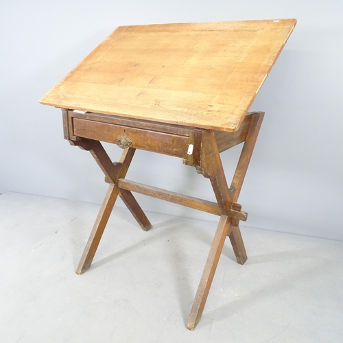 2692 - An antique mahogany clerk's desk / drafting stand with lifting pine top and single drawer. 107x98x74... 