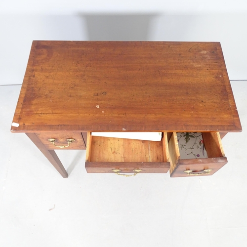 2697 - An early 20th century crossbanded mahogany lady's writing desk, with three drawers and raised on squ... 