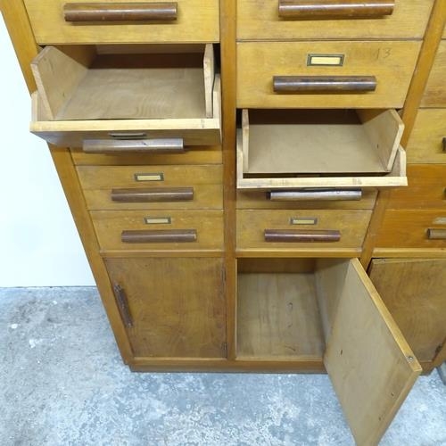 2713 - A French mid-century Notaire cabinet, with 24 drop-front drawers and three cupboards under. 121x191x... 