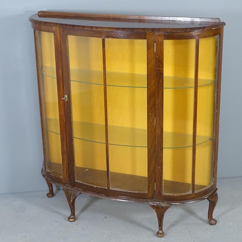 2733 - A mahogany bow-front display cabinet with two glass shelves. 106x113x30cm. One leg requires re-attac... 