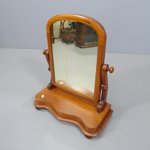 2738 - A Victorian mahogany swing toilet mirror on serpentine front base. 48x59x23cm.