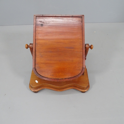 2738 - A Victorian mahogany swing toilet mirror on serpentine front base. 48x59x23cm.