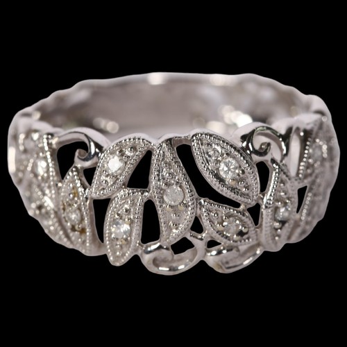 1210 - A delicate 9ct white gold and diamond set dress ring, with openwork decoration, size R