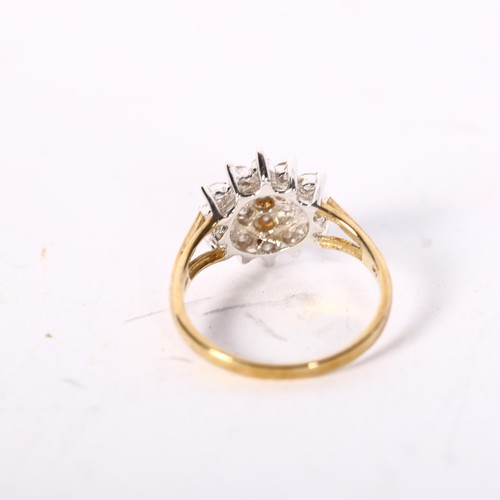 1211 - A 9ct gold diamond set flowerhead design ring, size N