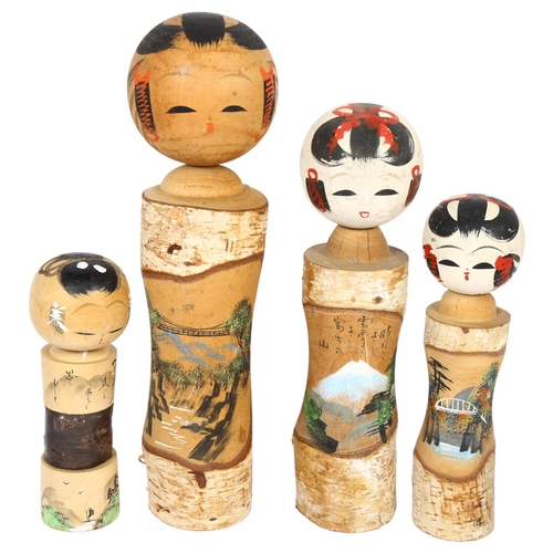 678 - 4 graduated Kokeshi dolls, tallest 37cm