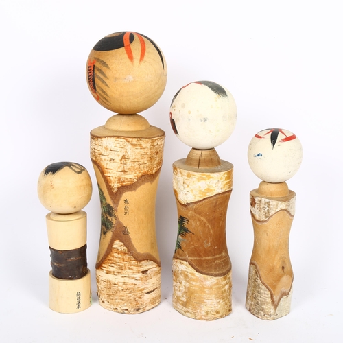 678 - 4 graduated Kokeshi dolls, tallest 37cm