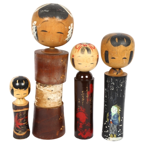 679 - A group of 4 Japanese Kokeshi dolls, tallest 38cm