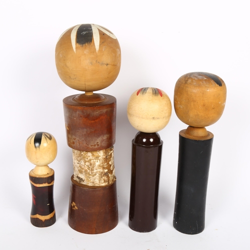 679 - A group of 4 Japanese Kokeshi dolls, tallest 38cm