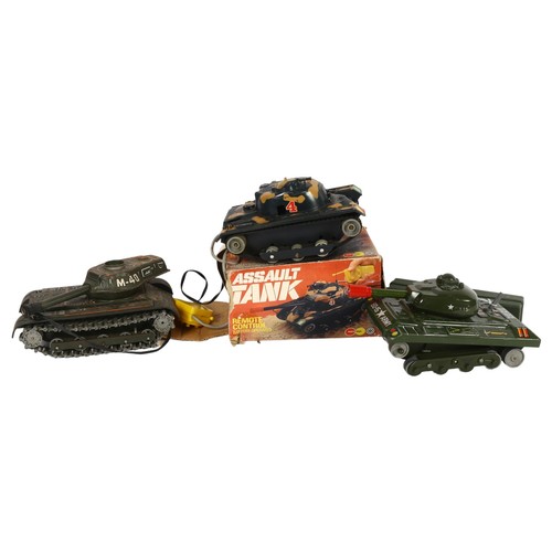 83 - Marx toys - A boxed battery operated remote controlled assault tank and 2 other battery operated tin... 