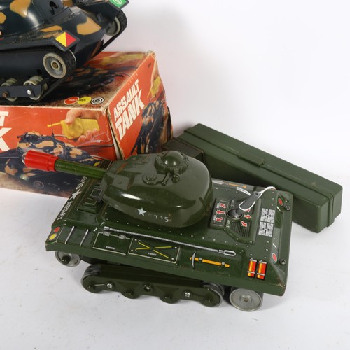 83 - Marx toys - A boxed battery operated remote controlled assault tank and 2 other battery operated tin... 