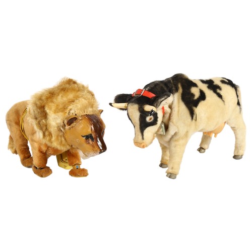 85 - A Japanese Roscoe toys battery operated cow - Josie, and a battery operated remote controlled lion. ... 