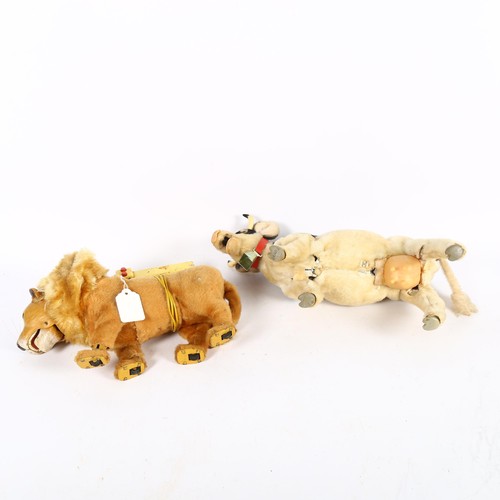 85 - A Japanese Roscoe toys battery operated cow - Josie, and a battery operated remote controlled lion. ... 