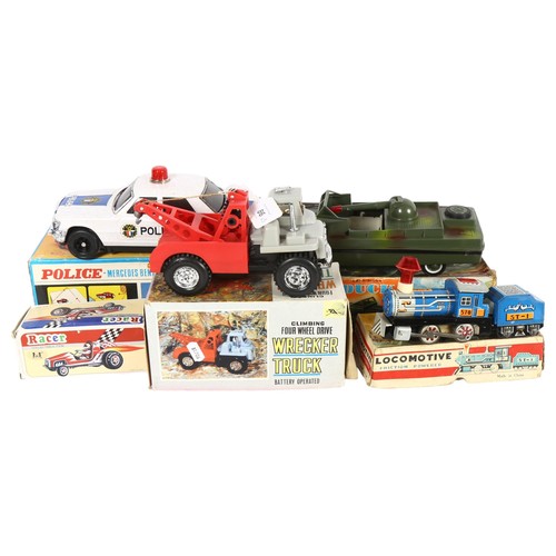 86 - A tin plate and plastic, battery operated Police Mercedes-Benz vehicle, a Bump'n'go vehicle in origi... 