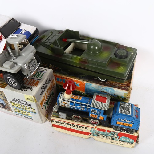 86 - A tin plate and plastic, battery operated Police Mercedes-Benz vehicle, a Bump'n'go vehicle in origi... 